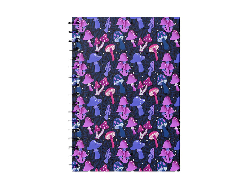 Photo shows a notebook on a white backgrond. The notebook has hand illustrated mushrooms in a variety of types and shades of pink, fushia, lavender, and indigo. It is set on a dark blue background with vines of leafs intertwined. There are magical twinkle stars scattered about for a real enchanted forest feel. A gorgeous piece of magical, bohemian, stationery.