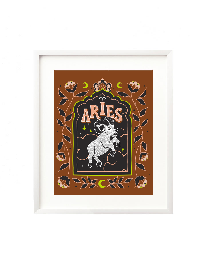 A framed art print - the illustration is a depiction of the Aries zodiac sign. The ram is illustrated floating in a starry night sky, surrounded by whimsical clouds and framed in by folk art flowers. Aries is hand lettered at the top in a bold, groovy, retro inspired style.