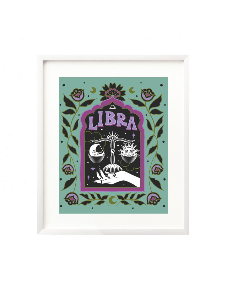 A framed art print - the illustration is a depiction of the Libra zodiac sign. The celestial scale is illustrated floating in a starry night sky, surrounded by whimsical clouds and framed in by folk art flowers. Libra is hand lettered at the top in a bold, groovy, retro inspired style.