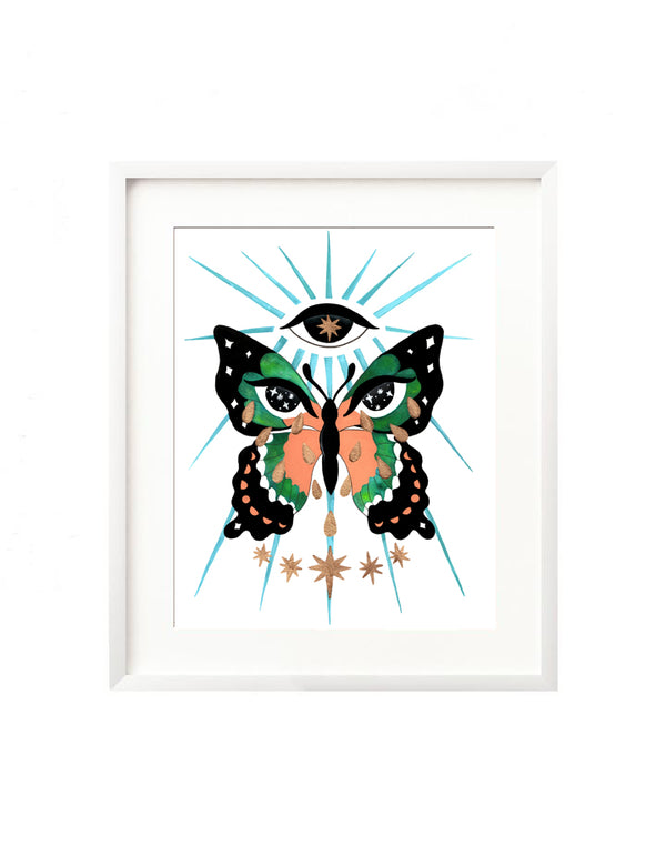 A framed art print. The illustration is of a pink teal and black butterfly with moon phases in its bottom wings. In the top wings are a pair of intuitive eyes, filled with stars, and crying golden tears. Above the butterfly is an eye with a star inside, and below are gold stars. There are light beams emanating from the eye representing the metamorphosis that occurs through your healing journey.